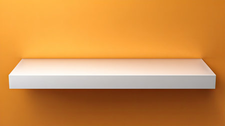 A white shelf is mounted against an orange wall in this image. The shelf appears clean and empty, offering copy space. The scene is lit with diffused lighting, suggesting an indoor setting. This image could be used for product display, retail, or conceptual design purposes.の素材