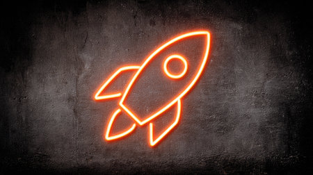 A vibrant neon rocket illustration is depicted against a rough, dark backdrop. The glowing orange outlines suggest a modern aesthetic with the play of light and shadow. This image could be suitable for various design projects, including digital content, website elements, and marketing materials.の素材