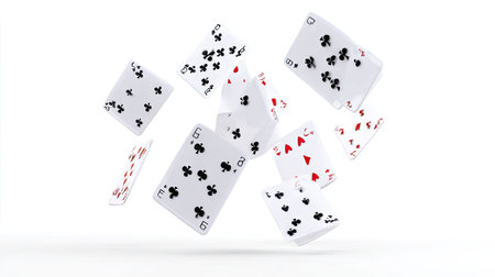 Playing cards featuring various suits and numbers are suspended in a white backdrop, demonstrating motion. The composition highlights contrasting colors and textures, suggesting concepts such as chance, decision, or game play. This image is suited for commercial uses related to entertainment, gambling, or design projects.の素材