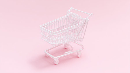 A small, transparent shopping cart is placed on a soft pink backdrop. The image showcases the object in a clean, minimalist style. The lighting appears soft and even, highlighting the cart's form. This image could be used for various commercial projects related to shopping, retail, or online commerce.の素材