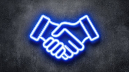 A neon-style illustration depicts a handshake, suggesting agreement and cooperation. The image features a bright blue outline on a dark, textured background. The composition is simple and clean, with a focus on the central subject. This graphic could be used in various commercial applications related to business, partnerships, or agreements.の素材