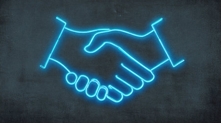 A neon blue handshake illustration glows against a textured concrete wall, representing partnership. The graphic uses simple lines creating a modern design. The image features high contrast with a dark background, suggesting a nighttime or indoor setting. Suitable for commercial projects involving business agreements.の素材