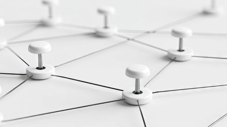 An overhead view shows white pushpins linked by thin black lines against a clean, white backdrop. The simple composition utilizes soft lighting to emphasize the connections. This arrangement may symbolize relationships, communication, or a project's interconnected elements, suitable for various editorial and commercial applications.の素材