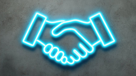 A neon blue handshake symbol is depicted on a textured gray background. The vibrant, glowing lines of the image stand out. This graphic could be used in various commercial applications. It might be suitable for representing collaboration, agreement, or partnerships in visual communications.の素材