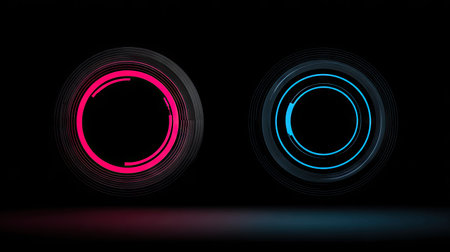 Two circular shapes illuminated with red and blue light display vibrant visual effects against a dark backdrop. The composition features a symmetrical arrangement, offering a modern aesthetic with subtle gradients. Suitable for digital designs, tech presentations, or visual concepts, the image has potential use in various commercial contexts.の素材