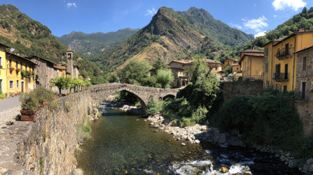 A quaint village is presented with a stone bridge gracefully arching over a flowing river. Buildings of various architectural styles line the riverbanks. The scene is illuminated by daylight, the composition capturing the natural environment under a clear blue sky. It could be used for travel, tourism or editorial content.の素材