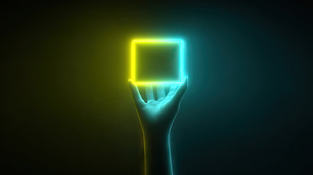 A hand holds a radiant, geometric shape lit with vibrant teal and yellow hues. The artwork features a smooth texture with a dark background. The composition uses dramatic lighting. This image could be suitable for use in design projects, advertising, or as an element in visual communications.の素材