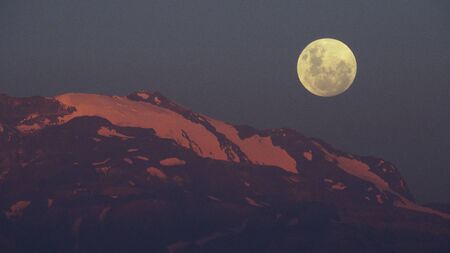 Moon rise at Mount Andes in Santiago Chileの写真素材