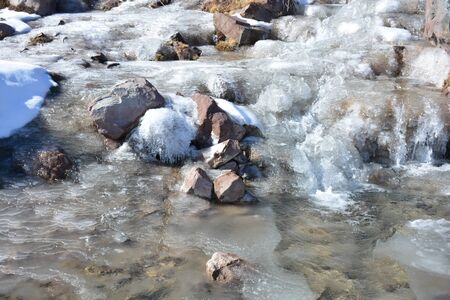 Frozen river during winter at a mountain in Santiago, Chileの写真素材