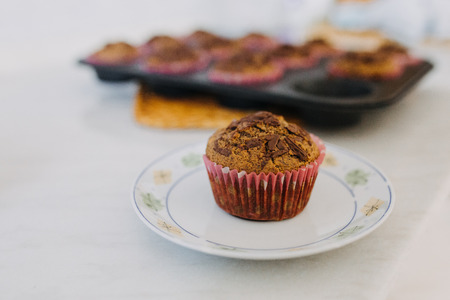 carob muffin on a white plateの写真素材