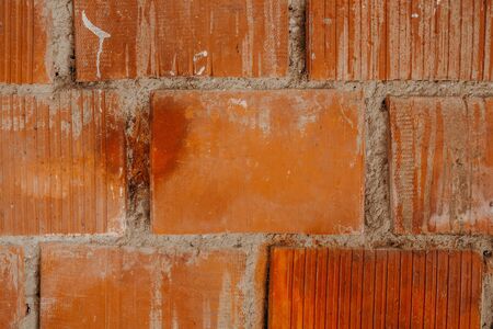 orange brick stone wall backgroundの写真素材