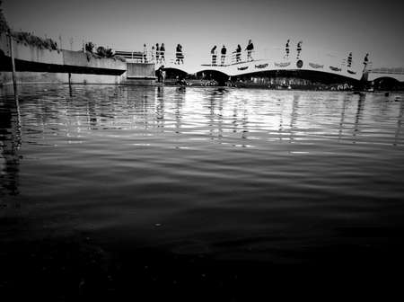 Pedestrian bridge at Swy-a-Lana Lagoon, black and white, Maffeo Park, BCの写真素材
