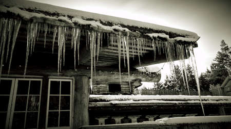 Rooftop icicles, black and white.の写真素材