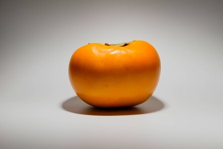 Fresh fruit. Hard persimmon. Sweet fruitの写真素材