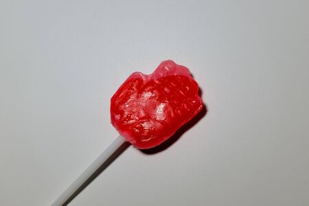 Lollipops. Strawberry flavored cherry candy. Palm shape candyの写真素材