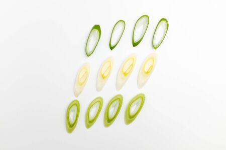 Delicious green onions. Succulent green onions. White background waveの写真素材