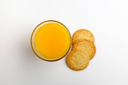 Sable and orange juice. Sweets and juice. dessert. Sweet dessertの写真素材