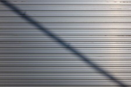 Shutter made of iron. Pattern in regular shape. Neat shapeの写真素材