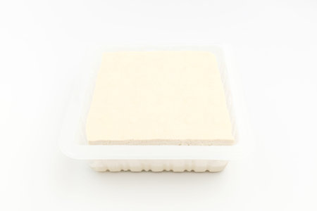 Food made from beans. Ingredients often eaten in Asia. Tofu in square shape