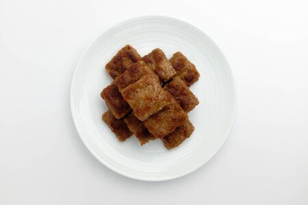 Meat seasoned dish. Crushed meat. Vegetable and meat dishesの写真素材