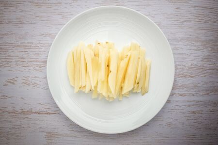 Elongated potatoes. Peeled potatoes. Moist raw potatoesの写真素材