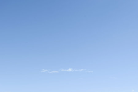Bright sky. Soft white clouds. A beautiful gradient skyの写真素材