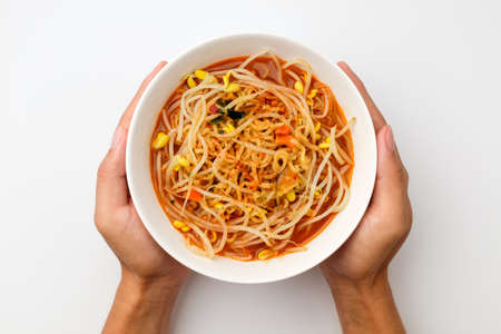 Instant ramen with vegetables. Soup with bean sprouts. Spicy korean foodの写真素材