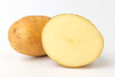 Raw potatoes with soil. Potatoes in a round shape. Beautiful and fresh potatoesの写真素材