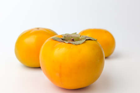 Fresh fruit.Sweet persimmonの写真素材