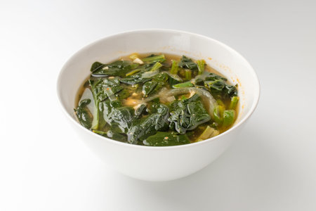 Asian food culture. Miso soup with vegetables. Cooking broth with vegetables