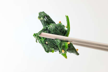 Food seasoned with plants. Side dish made with spinach. Cooking fresh vegetablesの写真素材