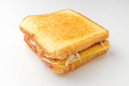 One kind on a sandwich. Vegetables, ham, cheese, and eggs. Easy meal made from breadの写真素材