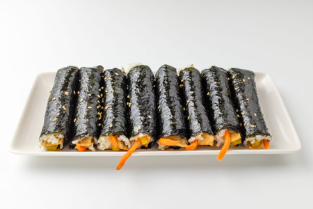 Asian food culture. Rice and vegetables wrapped in seaweed. Light and savory food