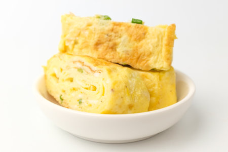 Cooking several layers of eggs. Egg dish with vegetables. Soft and light egg dishの写真素材