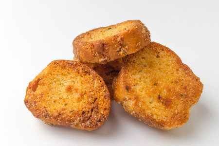 Garlic flavored bread. Bread with a savory taste. Sliced â€‹â€‹baguette and seasoned