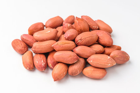 Savory nuts. Uncooked peanuts. Savory and hard vegetables