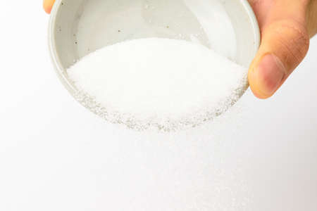 Sweet food. Powdered food. White powder seasoningの写真素材