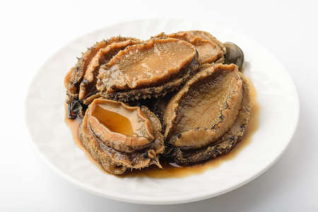 Abalone seasoned in soy sauce. Asian food culture. Seafood foodの写真素材
