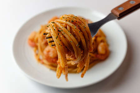 Tomato Cream Sauce Pasta. A dish with tomato and cream sauce. Flour noodlesの写真素材