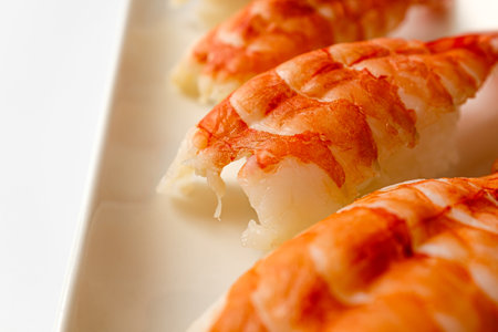 Black tiger prawn sushi on white backgroundの写真素材