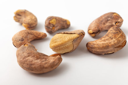 Shelled cashew nuts on white background