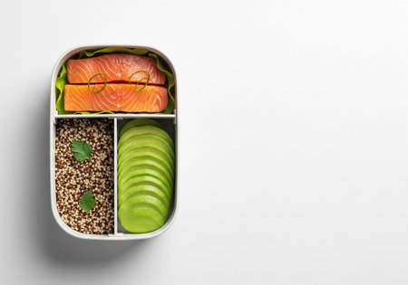 Minimalist Healthy Bento with Raw Salmon, Quinoa, and Sliced Avocado on White Backgroundの素材