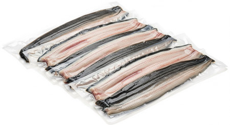 Vacuum Sealed Packages of Fresh Eel Fillets on a White Backgroundの素材
