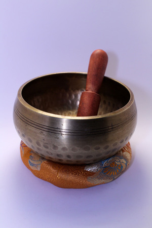 A Buddhist Tibetan singing bowl made in Nepal. A close up view.の写真素材