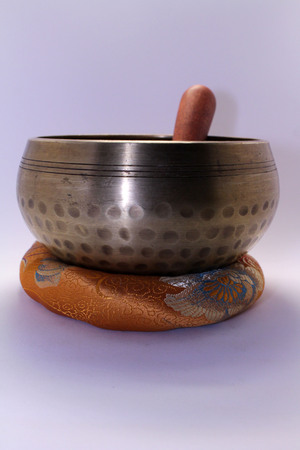 A Buddhist Tibetan singing bowl made in Nepal. A close up view.の写真素材