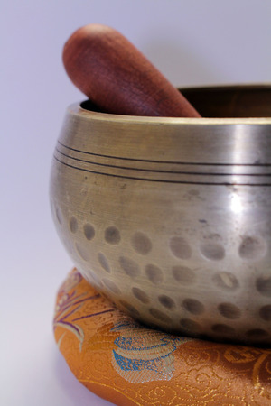 A Buddhist Tibetan singing bowl made in Nepal. A close up view.の写真素材