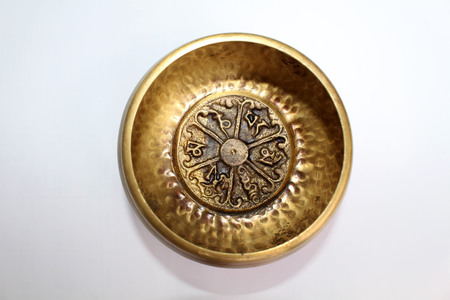 A Buddhist Tibetan singing bowl made in Nepal. A close up view.の写真素材