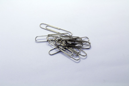 A pile of paper clip or paperclip, used to hold sheets together. Made of wire.の写真素材