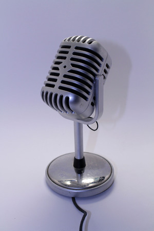 A mic, mike, or microphone with its cable. Taken with white background.の写真素材