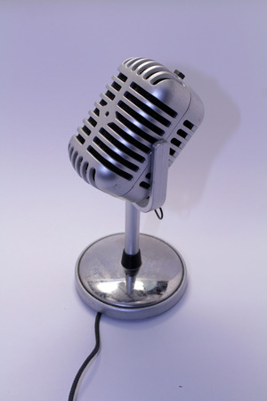 A mic, mike, or microphone with its cable. Taken with white background.の写真素材